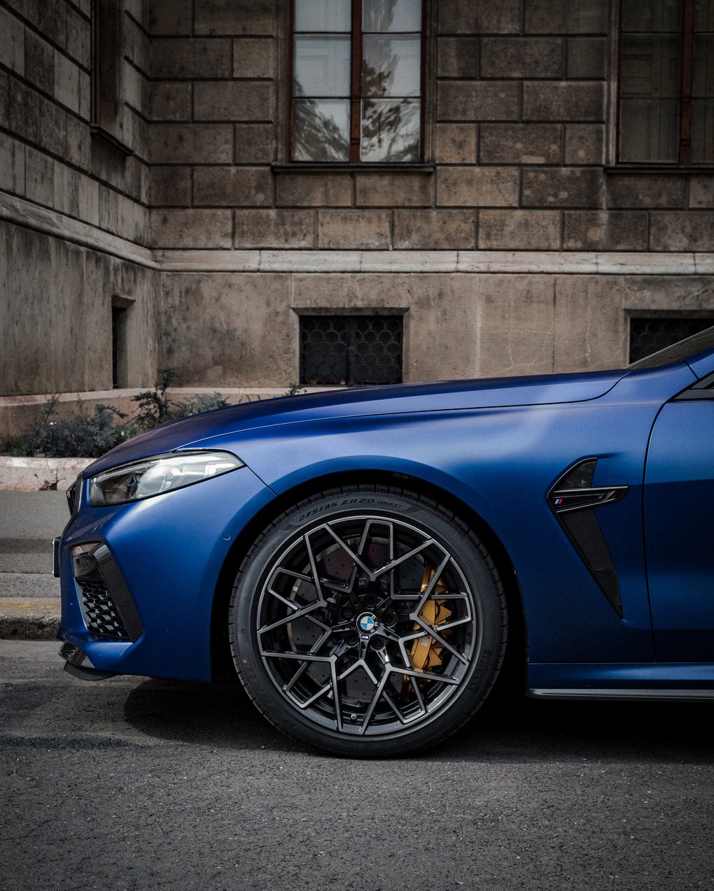 Blue Car Parked Near Concrete Building